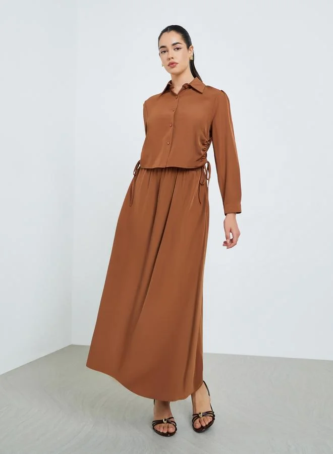 أميرة طقم من قميص مزموم وتنورة طويلة محتشم